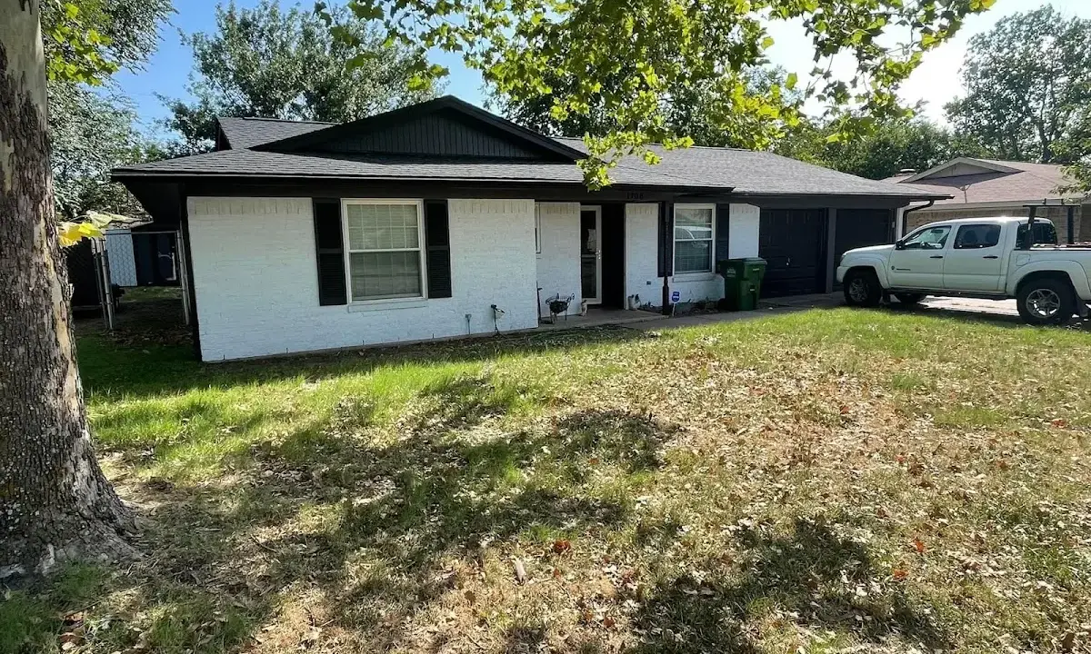 Professional roofing crew working on a residential roof in Gardiner